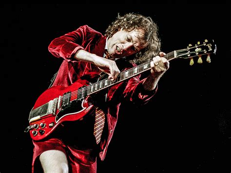 What Guitar Did Angus Young Play: A Symphony of Strings and Shadows